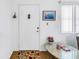 A front door with a storm door and floral rug at 5347 81St N Ln # 25, St Petersburg, FL 33709