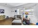 Living room featuring a cozy armchair, wood-look flooring and neutral decor at 5347 81St N Ln # 25, St Petersburg, FL 33709