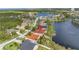 An aerial view of a beautiful home on a waterfront property in a lush community at 540 Somerhill Ne Dr, St Petersburg, FL 33716