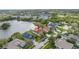 Aerial shot of neighborhood home near a lake, showcasing its desirable location and well-maintained surroundings at 540 Somerhill Ne Dr, St Petersburg, FL 33716