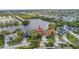 This aerial view showcases the home's lakeside location and community at 540 Somerhill Ne Dr, St Petersburg, FL 33716