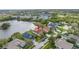 This aerial view showcases the home's lakeside location and community at 540 Somerhill Ne Dr, St Petersburg, FL 33716