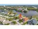 This aerial view showcases the home's lakeside location and community at 540 Somerhill Ne Dr, St Petersburg, FL 33716
