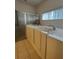 This bathroom features a walk-in tub, a shower, and a large window at 540 Somerhill Ne Dr, St Petersburg, FL 33716