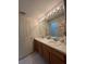 Bright bathroom boasts double sinks, a large mirror, and vanity at 540 Somerhill Ne Dr, St Petersburg, FL 33716