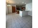 Kitchen with wooden cabinets, quartz countertops, and island with tile flooring at 540 Somerhill Ne Dr, St Petersburg, FL 33716