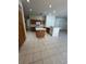 Spacious open kitchen with wooden cabinets, island, and tile flooring at 540 Somerhill Ne Dr, St Petersburg, FL 33716