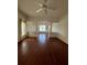 Living room boasts hardwood floors and decorative columns at 540 Somerhill Ne Dr, St Petersburg, FL 33716