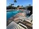 Large community pool with lounge chairs and covered area at 540 Somerhill Ne Dr, St Petersburg, FL 33716