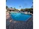 Large community pool with lounge chairs and a gazebo at 540 Somerhill Ne Dr, St Petersburg, FL 33716