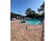 Community pool with a hot tub and lounge chairs around the deck at 540 Somerhill Ne Dr, St Petersburg, FL 33716