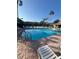 Community pool with tennis courts in the background at 540 Somerhill Ne Dr, St Petersburg, FL 33716