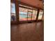 Bright sunroom featuring tile floors and expansive views of the lake at 540 Somerhill Ne Dr, St Petersburg, FL 33716