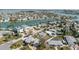 Panoramic aerial shot of a waterfront neighborhood, showcasing canals and nearby ocean at 596 S Bayshore Dr, Madeira Beach, FL 33708