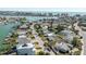 Stunning aerial view of waterfront homes, canals, and ocean in a coastal community at 596 S Bayshore Dr, Madeira Beach, FL 33708