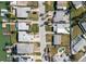 Top-down aerial view of homes and canals, showcasing a waterfront neighborhood with direct access to the open water at 596 S Bayshore Dr, Madeira Beach, FL 33708
