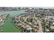 Aerial shot exhibiting real estate with boating access, canals, and a view of the ocean at 596 S Bayshore Dr, Madeira Beach, FL 33708