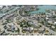 Wonderful aerial view showcasing homes with landscaped yards, water access, and canals at 596 S Bayshore Dr, Madeira Beach, FL 33708