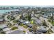 Aerial view of a waterfront home in a neighborhood with city views at 596 S Bayshore Dr, Madeira Beach, FL 33708