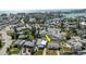 An aerial view with an arrow, pointing to a single-story home featuring a pool and patio area at 596 S Bayshore Dr, Madeira Beach, FL 33708
