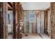 Unfinished bathroom with a window, exposed pipes, and plenty of remodeling potential at 596 S Bayshore Dr, Madeira Beach, FL 33708