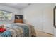 Bedroom featuring a dresser, TV, and closet at 5998 Grove S St, St Petersburg, FL 33705