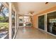 This screened porch offers views of a verdant backyard at 5998 Grove S St, St Petersburg, FL 33705