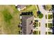 Overhead view of a townhouse property featuring well-maintained landscaping, dedicated parking, and a private yard at 6907 Holly Heath Dr, Riverview, FL 33578