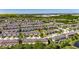 Aerial view of a residential neighborhood with colorful townhouses, lush greenery, and well-maintained surroundings at 6907 Holly Heath Dr, Riverview, FL 33578