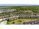 A charming neighborhood view showcases homes near a tranquil lake surrounded by lush green spaces at 6907 Holly Heath Dr, Riverview, FL 33578