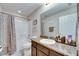 Bathroom with shower-tub combo, granite counter, and neutral color palette, creating a functional space at 6907 Holly Heath Dr, Riverview, FL 33578