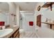 This bathroom features a sink with granite countertops and a spacious standing shower at 6907 Holly Heath Dr, Riverview, FL 33578