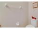 A toilet in a powder room with neutral color scheme at 6907 Holly Heath Dr, Riverview, FL 33578
