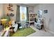 Cozy bedroom with bright window, plush decor, and carpeted floors for a warm, inviting space at 6907 Holly Heath Dr, Riverview, FL 33578