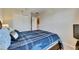This bedroom has soft carpet and is well lit by natural light from a large window at 6907 Holly Heath Dr, Riverview, FL 33578