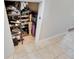 Organized closet space with shelving for shoes and accessories, maximizing storage in a compact area at 6907 Holly Heath Dr, Riverview, FL 33578