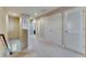 Upstairs hallway with carpet flooring, white doors and walls at 6907 Holly Heath Dr, Riverview, FL 33578