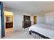 This main bedroom offers a bathroom, closet and direct access to the home's upper level at 6907 Holly Heath Dr, Riverview, FL 33578