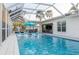 Screened pool with lounge chairs at 7040 Dr Martin Luther King Jr S St, St Petersburg, FL 33705