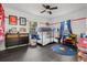 bedroom featuring bunk beds, ample storage, and a playful space theme at 803 S Evergreen Ave, Clearwater, FL 33756