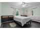 Bright bedroom with neutral walls, tile flooring, and large windows at 803 S Evergreen Ave, Clearwater, FL 33756
