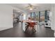 Bright dining room featuring a wooden table, tile floors, and direct access to the kitchen at 803 S Evergreen Ave, Clearwater, FL 33756