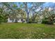 Quaint home nestled among mature trees, offering a peaceful setting and curb appeal at 803 S Evergreen Ave, Clearwater, FL 33756