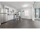 Well-lit kitchen with stainless steel appliances, white cabinetry, and center island at 803 S Evergreen Ave, Clearwater, FL 33756