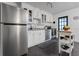 Close-up of a kitchen with stainless steel appliances and white cabinetry at 803 S Evergreen Ave, Clearwater, FL 33756