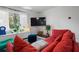 Cozy living room with bright seating, large window, and modern decor elements at 803 S Evergreen Ave, Clearwater, FL 33756