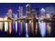 Beautiful night view of the illuminated city skyline reflecting on the water at 803 S Packwood Ave, Tampa, FL 33606