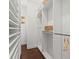 Walk-in closet with built-in shelving and hardwood floors at 803 S Packwood Ave, Tampa, FL 33606