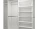 A spacious walk-in closet with adjustable shelving and rods, perfect for organized storage at 803 S Packwood Ave, Tampa, FL 33606