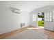 Clean, bright interior with tile floors, AC, and a door leading to a well-maintained yard at 803 S Packwood Ave, Tampa, FL 33606